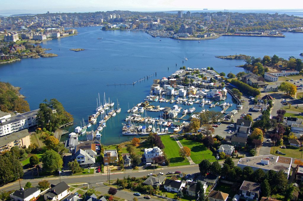 Aerial view of Victoria, BC harbour with marinas, waterfront homes, and Archipelago’s office near the shoreline.