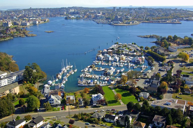 Aerial view of Victoria, BC harbour with marinas, waterfront homes, and Archipelago’s office near the shoreline.